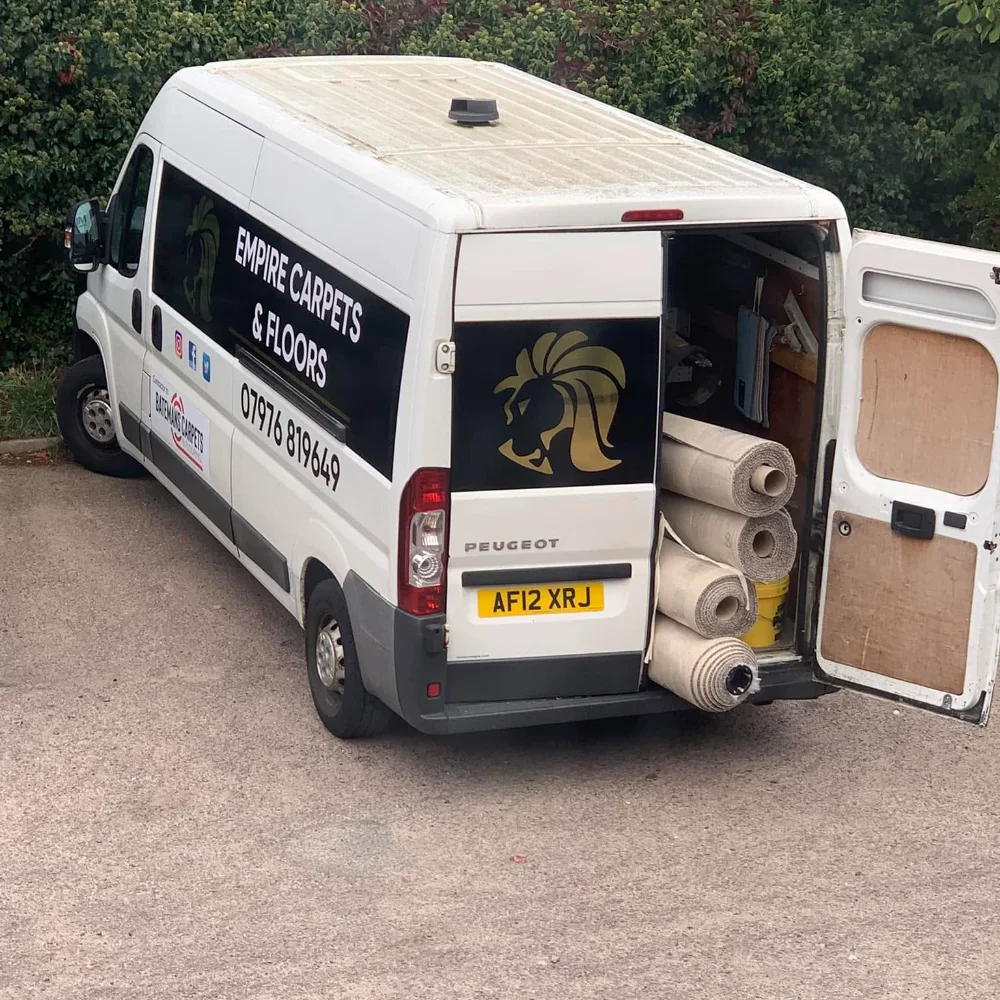 Empire Carpets & Floors van loaded with carpet rolls ready for a flooring installation