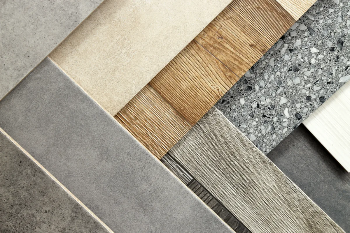 Flooring samples in wood, stone and concrete-effect finishes