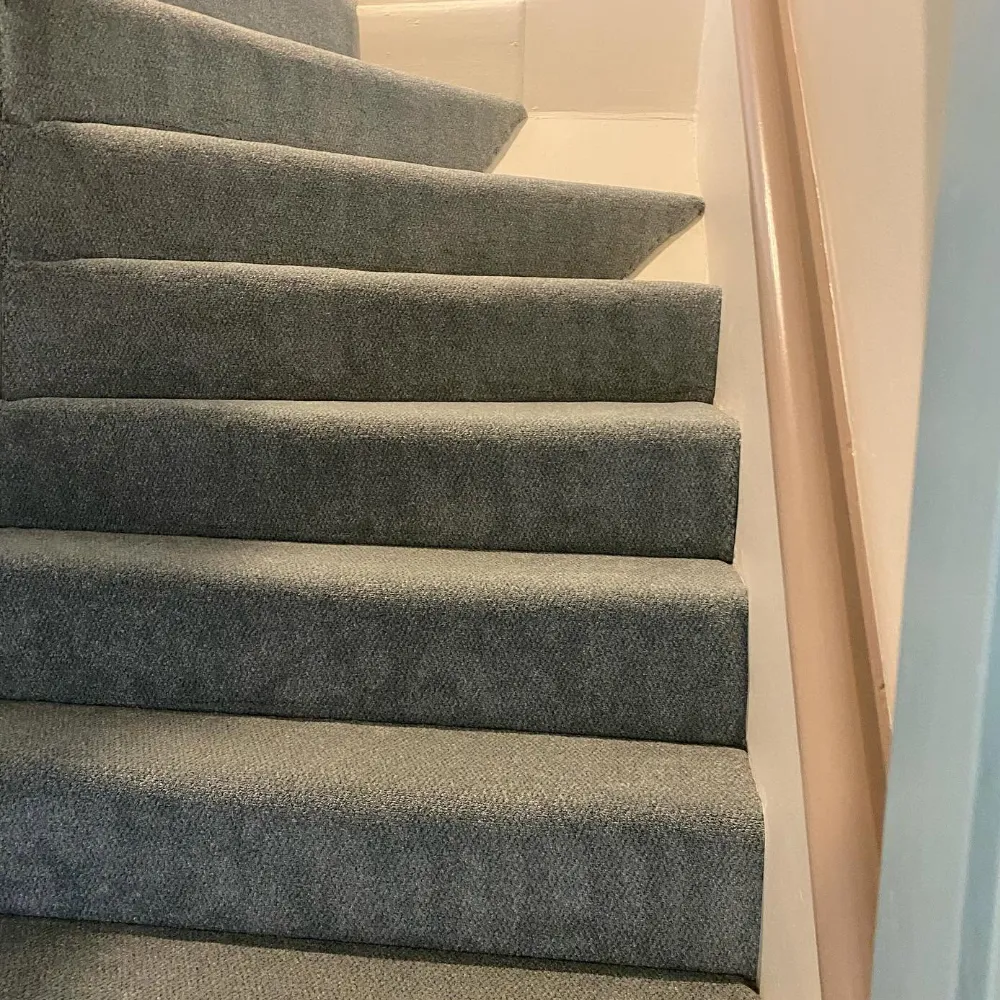 Grey carpet fitted on a residential staircase