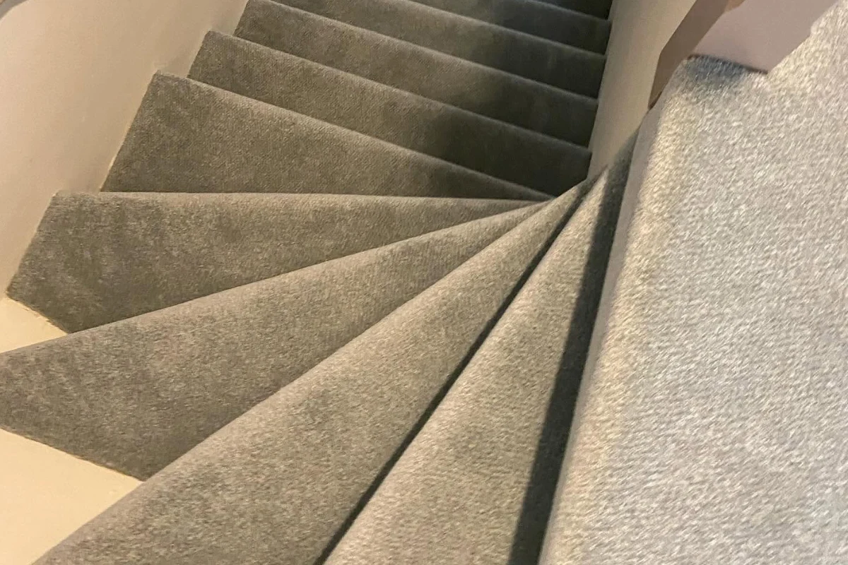 Grey carpet fitted on a staircase and upper landing